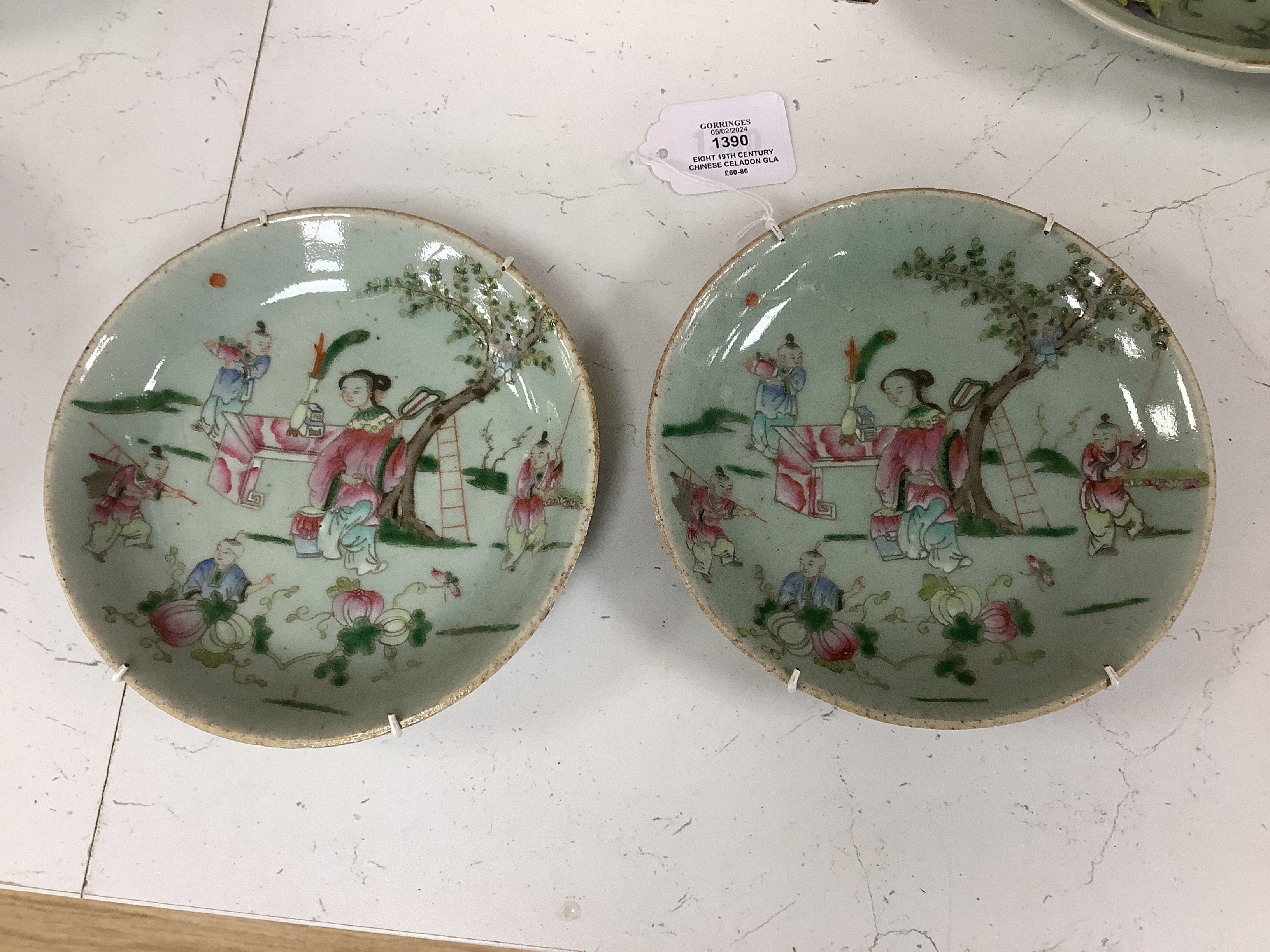 Eight 19th century Chinese celadon glazed famille rose dishes, largest 26cm